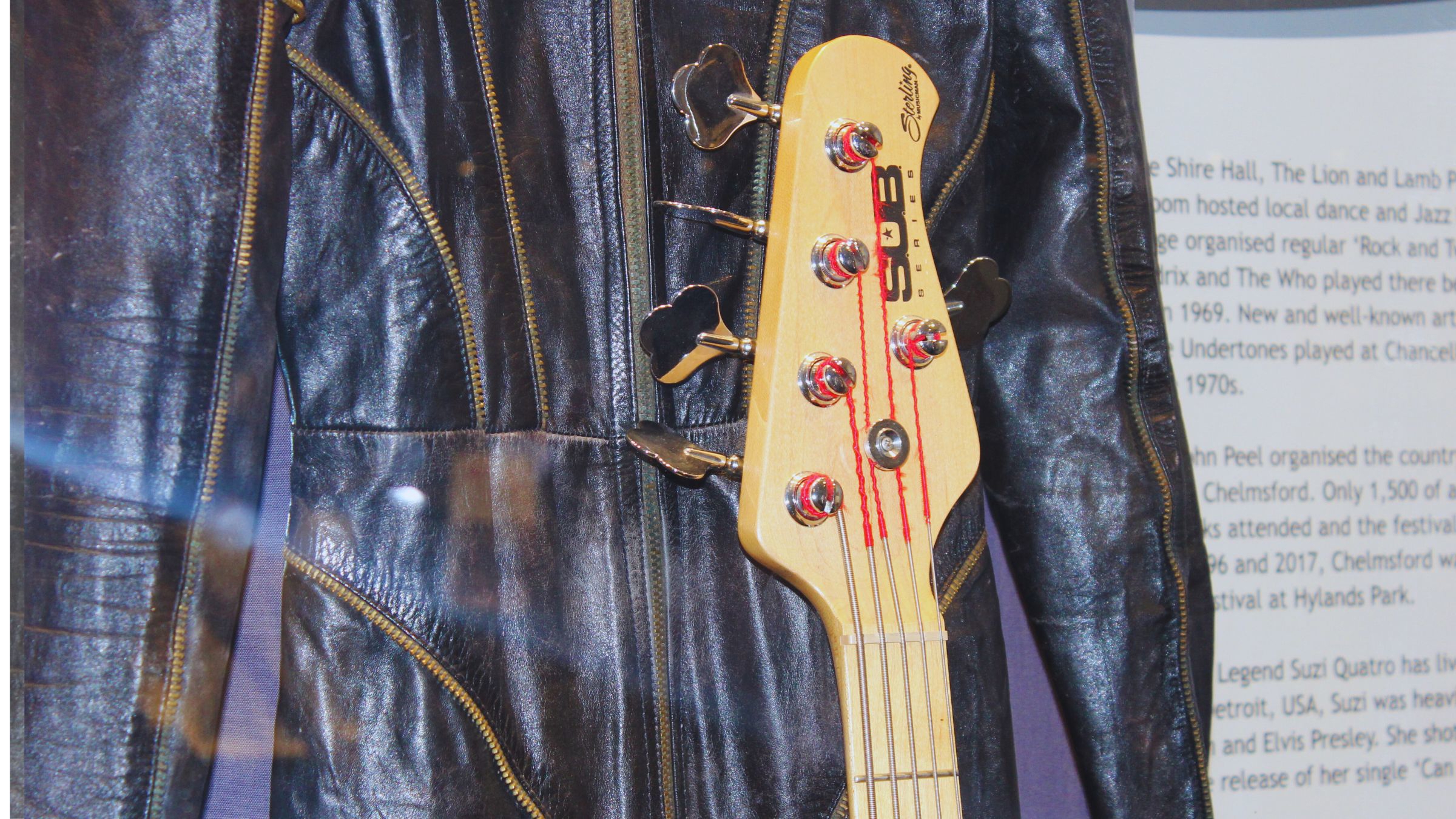 The neck of Suzi Quatro's black bass guitar