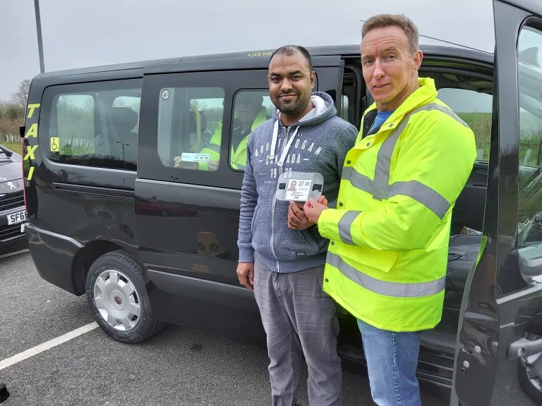 Licensing Officer Presents Driver With Identification