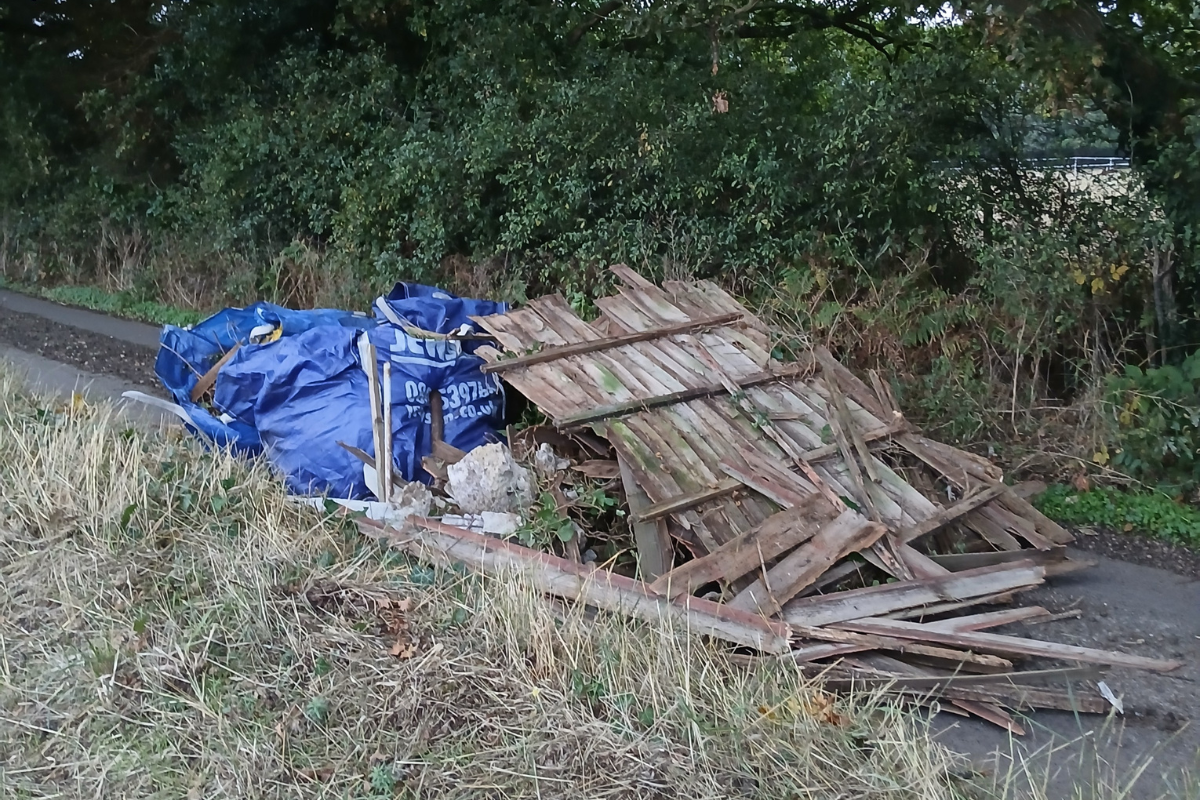 Items Including An Old Fence Block A Narrow Road