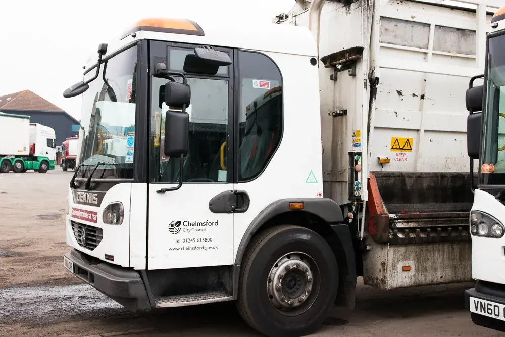 White bin lorry side on
