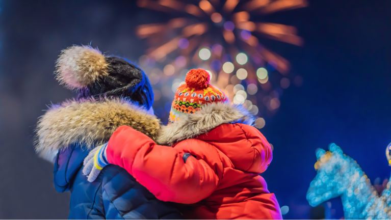 A Parent And Child Are Watching Fireworks