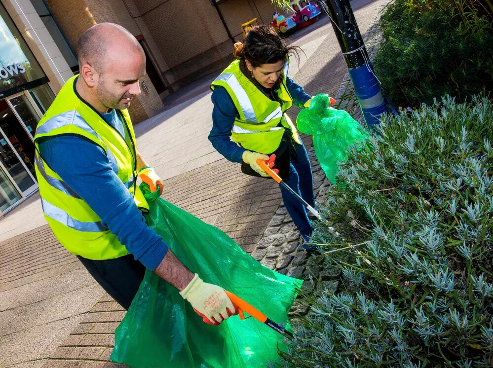 Man and woman litter picking
