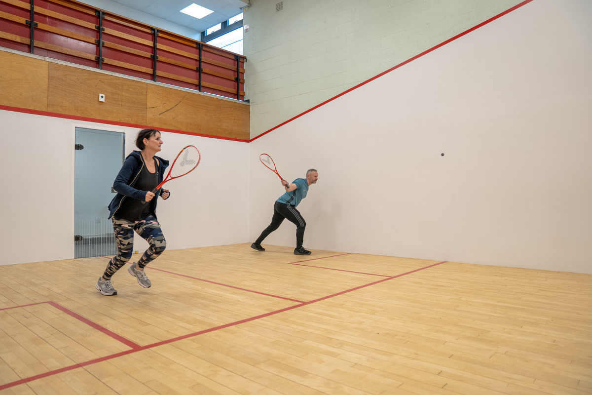 Two People Playing Squash At Dovedale Leisure Centre