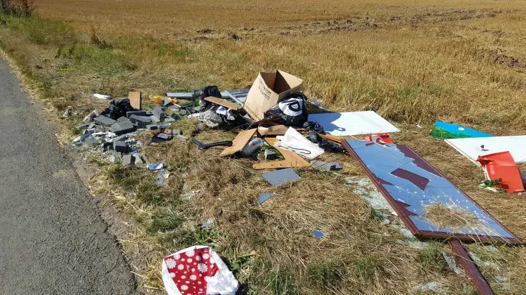 Fly-tipping on side of road