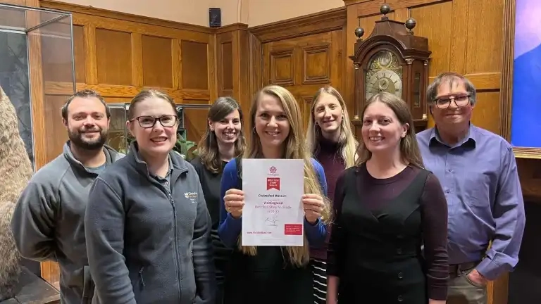 Museum Staff With Award