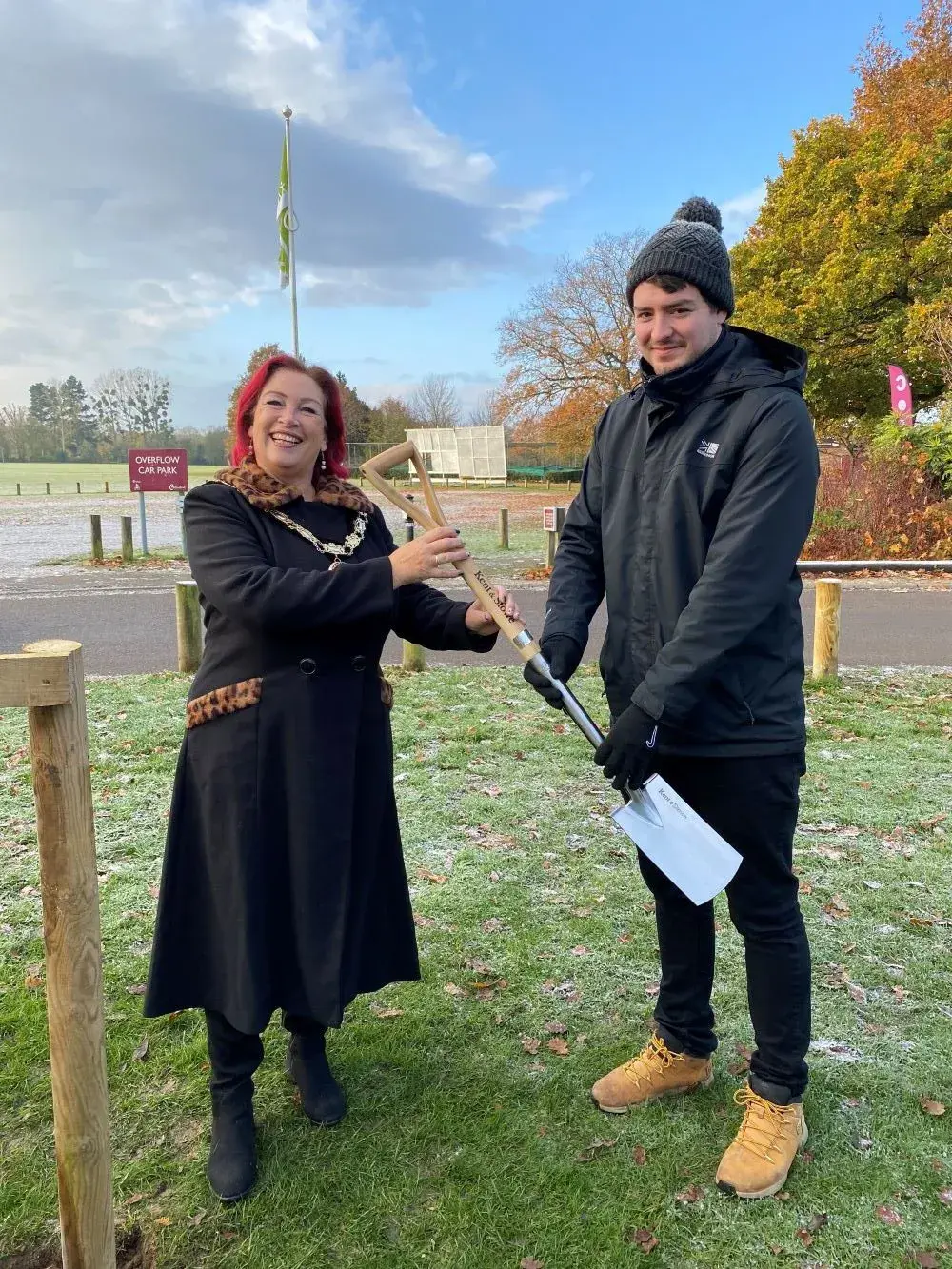 Mayor Mascot with Mark Brown being presented inscribed spade