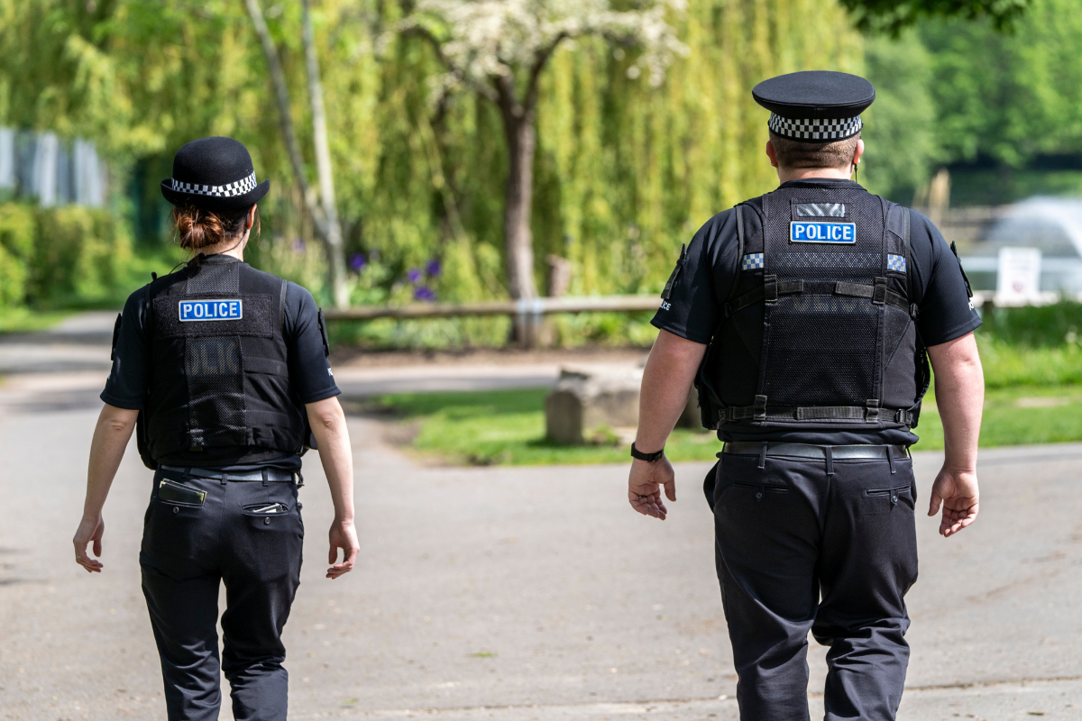 Two police officers patrol Central Park in Chelmsford.png