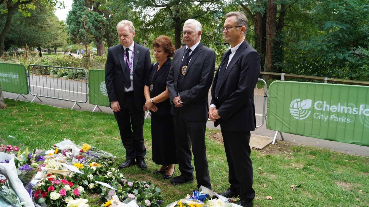 Senior Council Officials Laying Flowers For The Queen