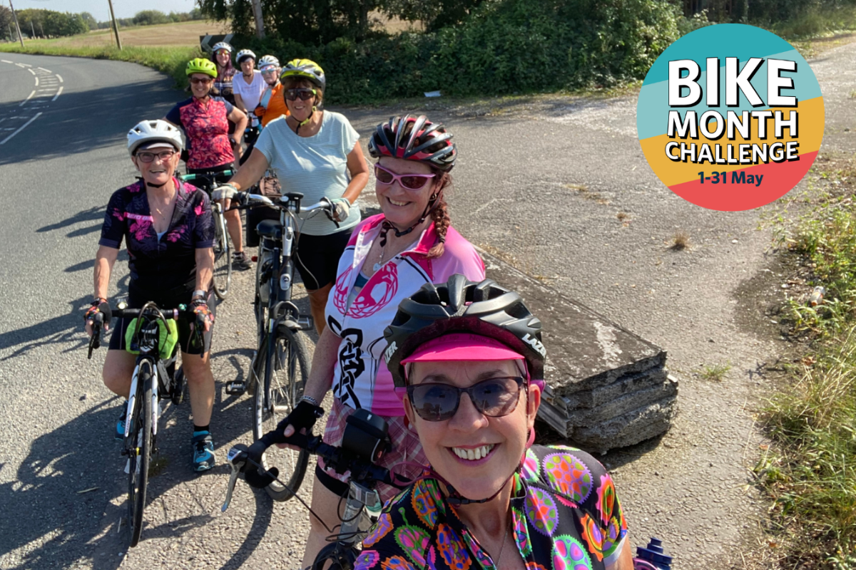 A Group Of Eight Female Cyclists Pause For A Selfie