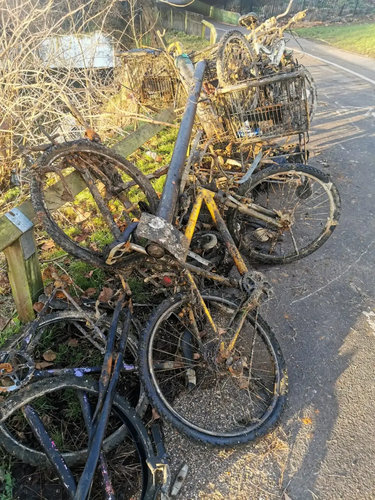 Rusted bicycles and shopping trolleys pulled from river