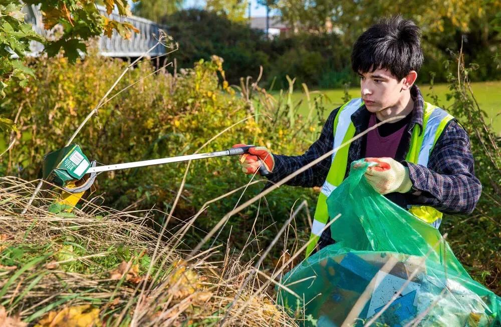 Young man litter picking
