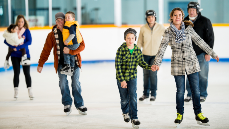3 families ice skating with children