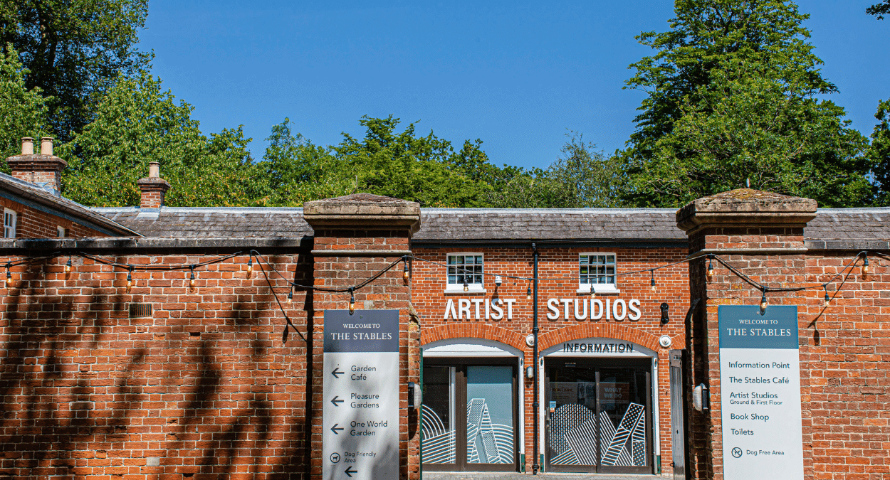The Red Brick Front Entrance Of The Stables On A Sunny Day