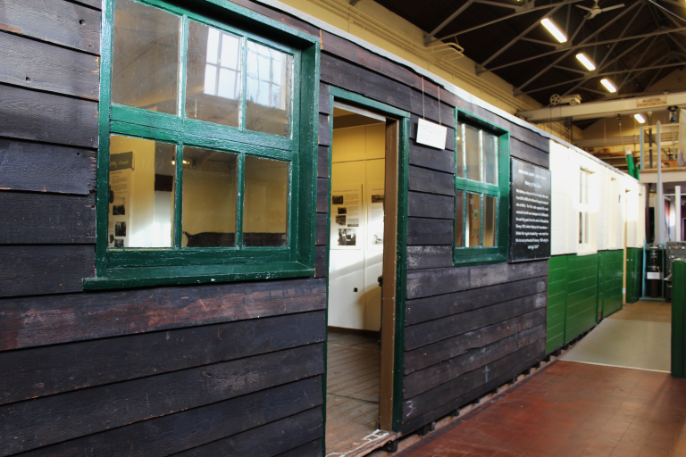 Exterior of Writtle Hut, with green window frames