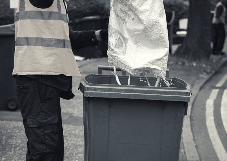 Paper Recycling Sack Being Collected (Black And White)