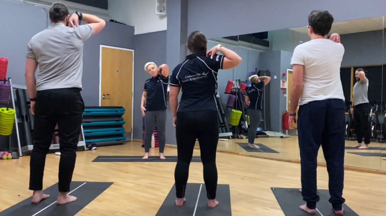 Participants Take Part In A Pilates Lesson