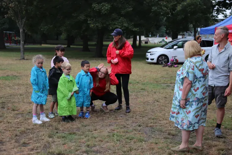 Raincoats At Play In The Park