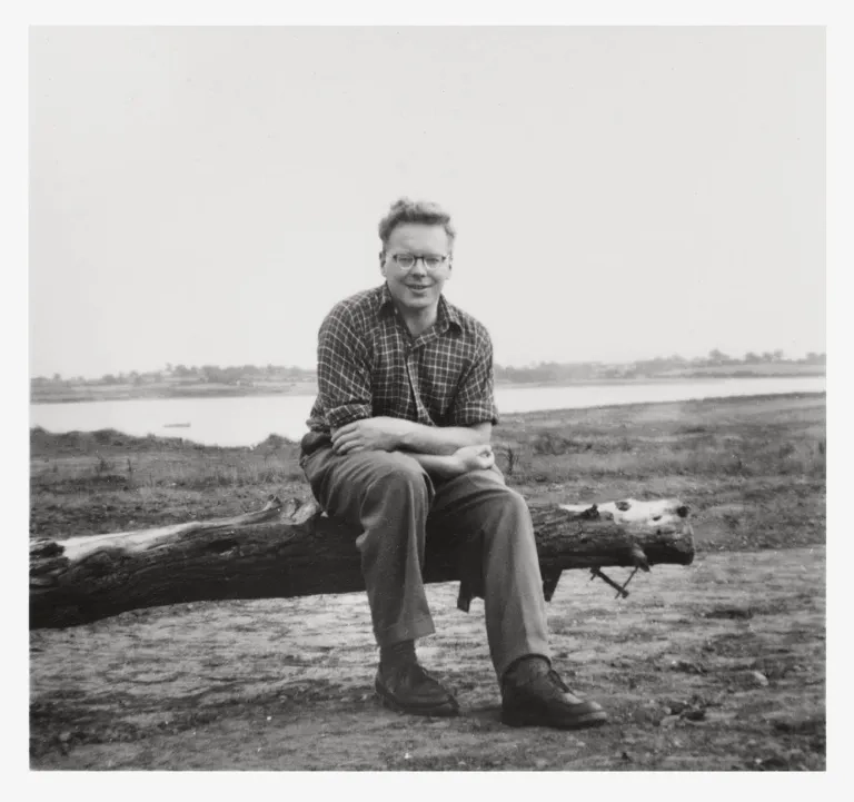 John Alec Baker Sitting On A Fallen Tree