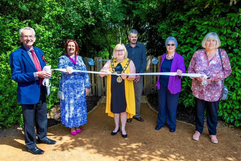 The Mayor Holding A Ribbon