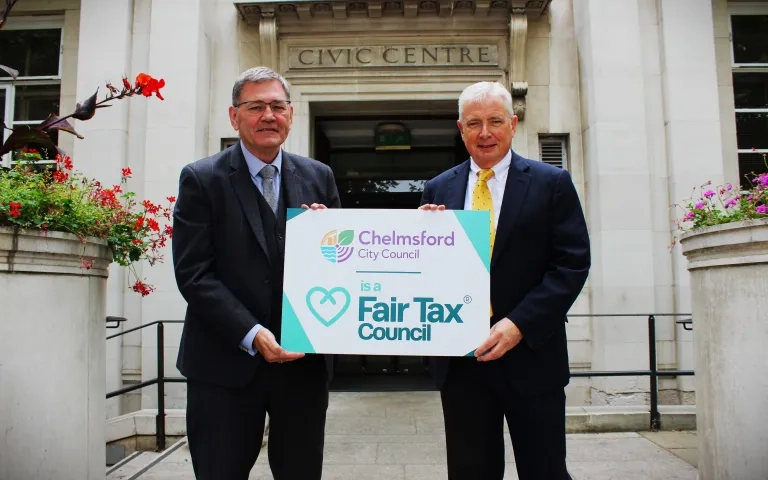 Cllr Hyland and Cllr Davidson holding a Fair Tax banner outside rhe Civic Centre
