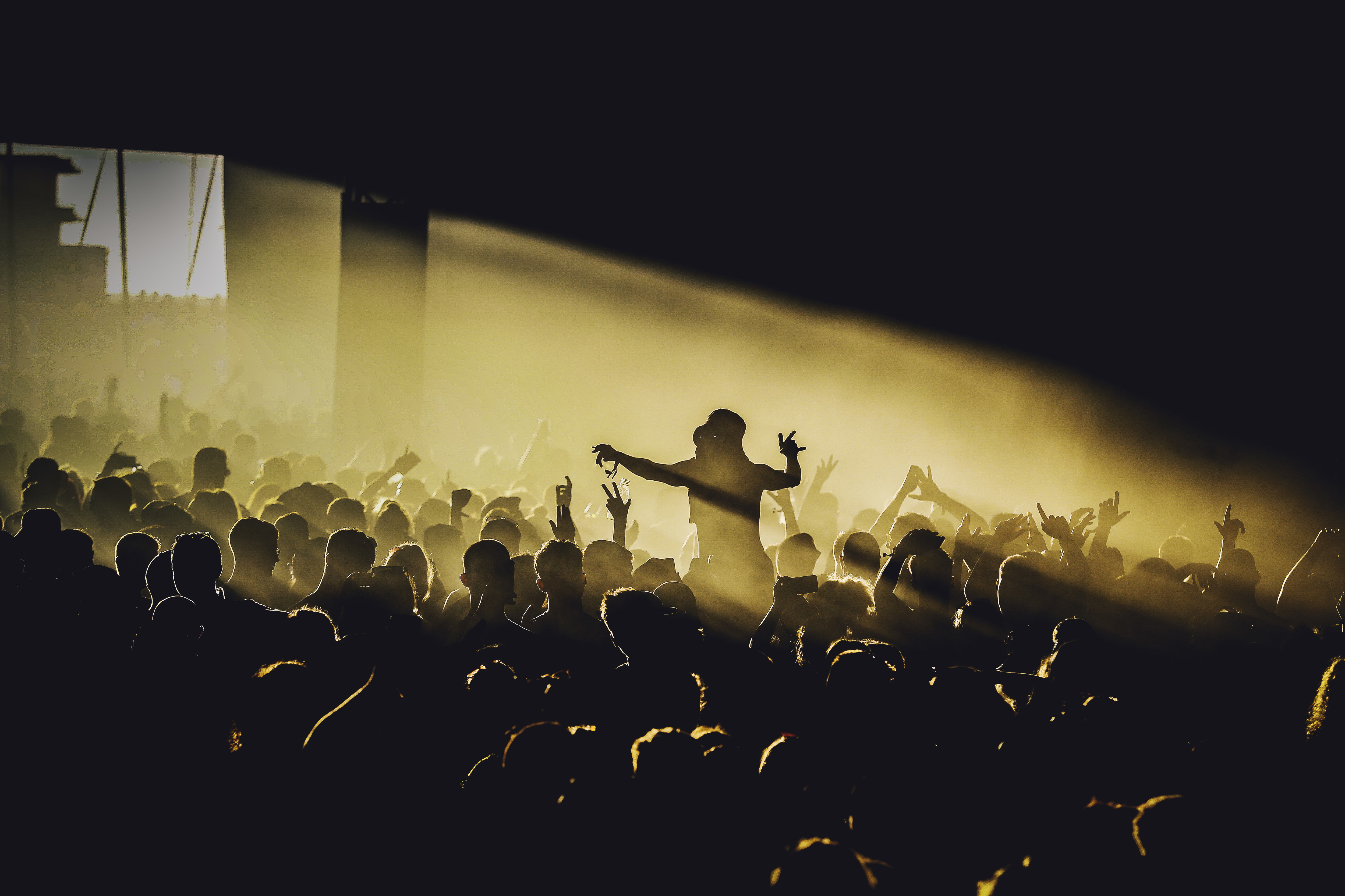 Inside A Music Tent, A Crowd Watches Including One Festival Goer On Her Friends Shoulders. Copyright Jack Kimber