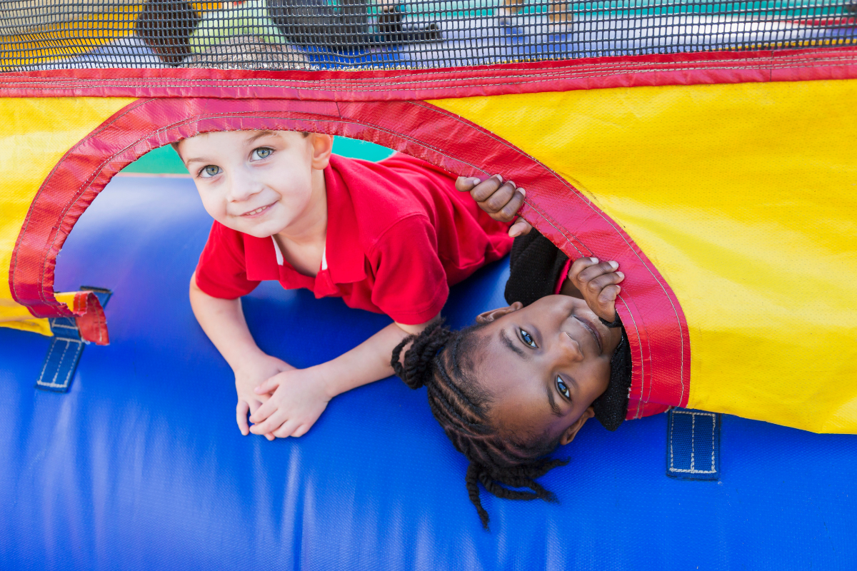 Children Play On A Bouncy Castle