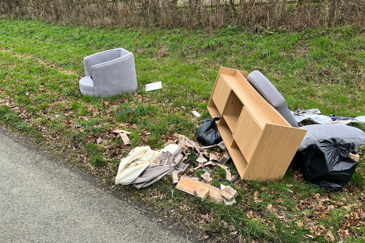 Household Waste Fly Tipped Along A Country Lane