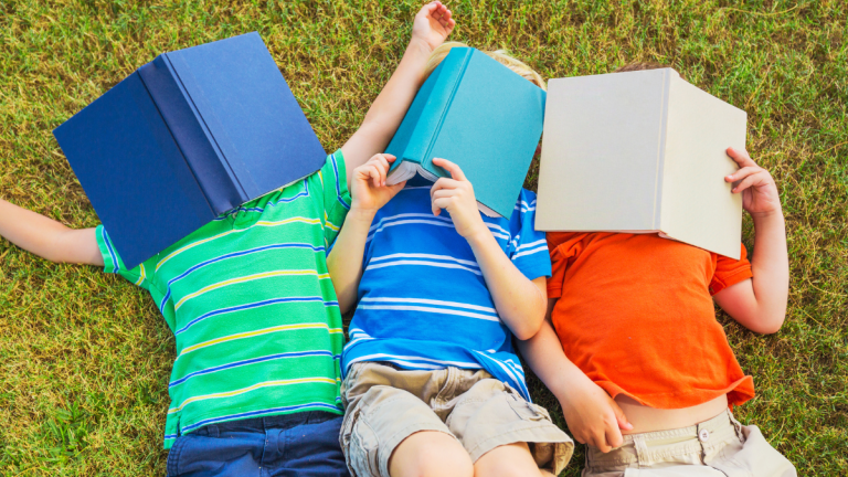 Children With Books On Their Faces