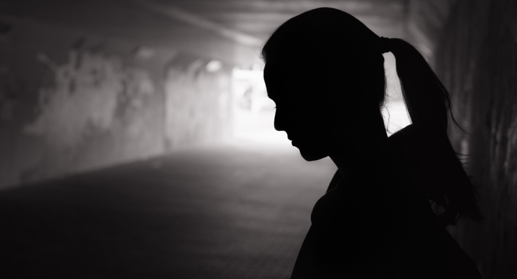 Black And White Photo Of A Woman Looking Down