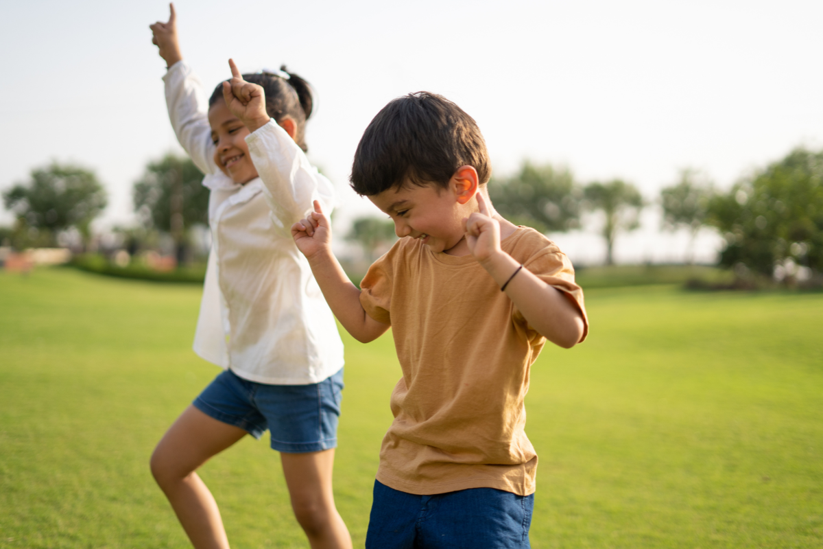 Happy Children Dancing Outside