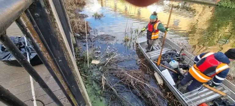 Boat full of litter pulled from the river