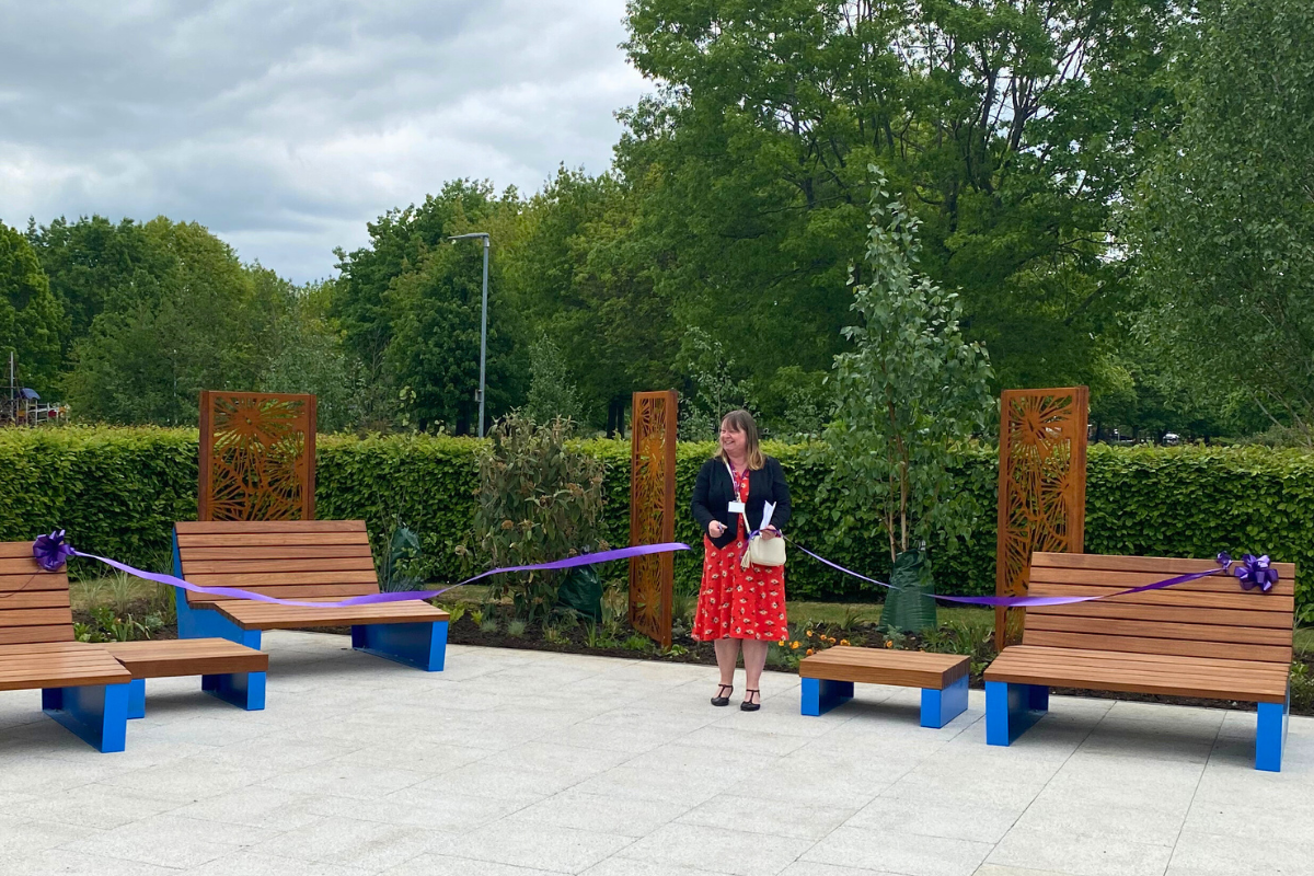 Councillor Donna Eley Cuts A Purple Ribbon To Officially Open Our Place