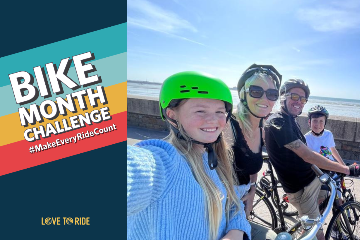 A Family Of Cyclists Smile By A Sea Wall