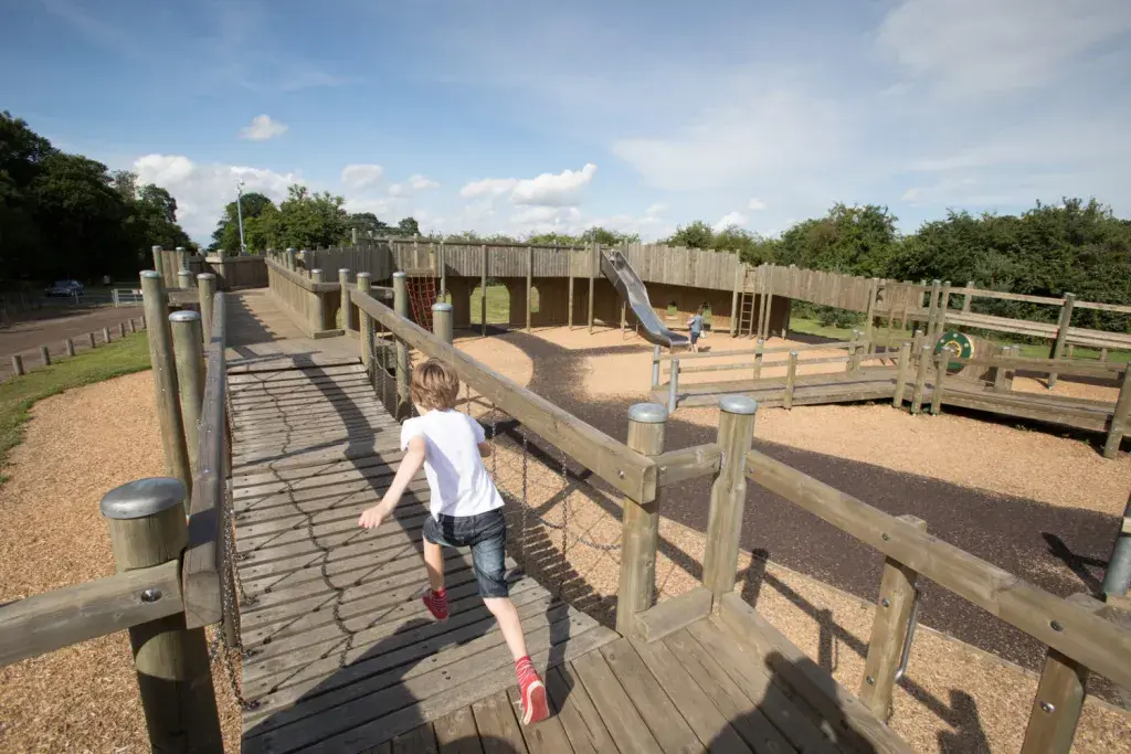 Kids Playing In A Wooden Castle Play Area